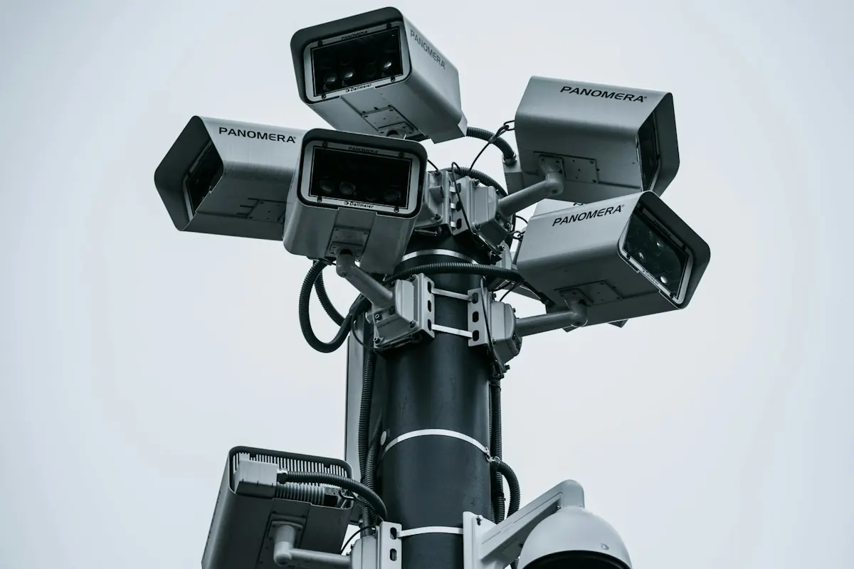 Cluster of security cameras mounted on a tall pole